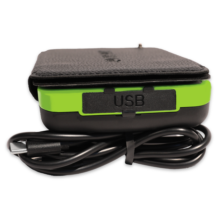 Side view of the JackPak PB20KS solar power bank in its leather case, with the USB port and cable attached.